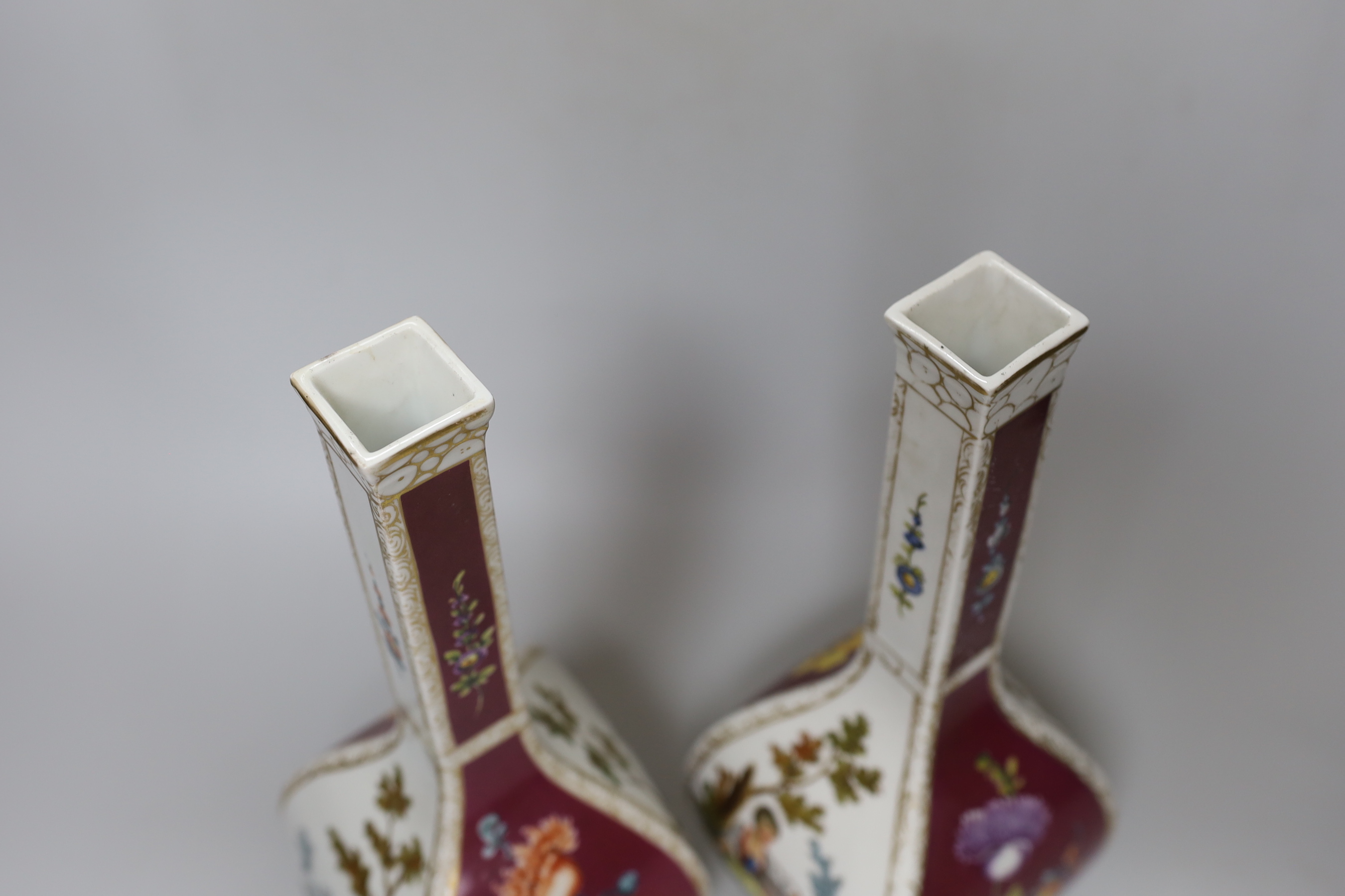 A pair of early 20th century Dresden square bottle vases, 31cm